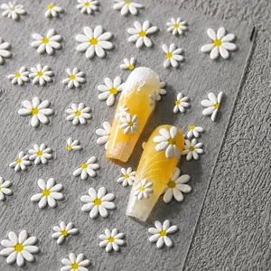 Detailed macro view of 5D embossed white daisy nail stickers with 3D relief texture