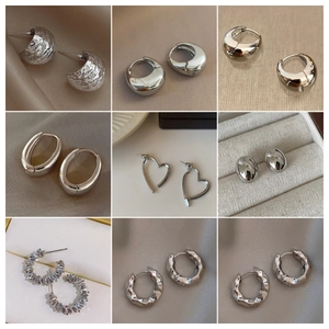 Collection of minimalist S925 silver geometric hoop earrings with polished metal finish