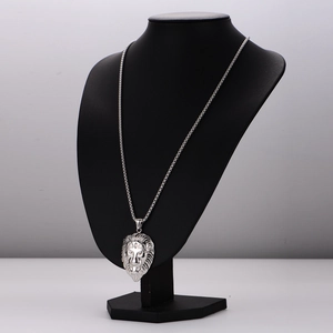 Retro stainless steel lion head pendant necklace for men on black mannequin display