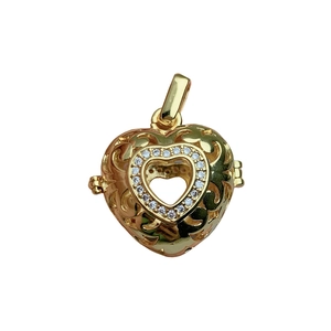 Golden filigree heart locket pendant with micro-set rhinestones on white background
