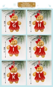 Detail view of alphabet gingerbread man felt ornaments with red hanging loops