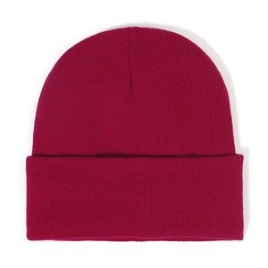 Detailed knit texture of burgundy beanie winter hat showing high quality fabric
