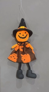 Macro shot of Halloween pumpkin witch doll with lace collar and hanging string