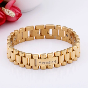 Detailed macro view of gold stainless steel watch band bracelet with magnetic therapy beads