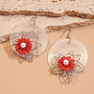 Detailed view of pearl shell earrings with red flower petals and silver metal wire frame