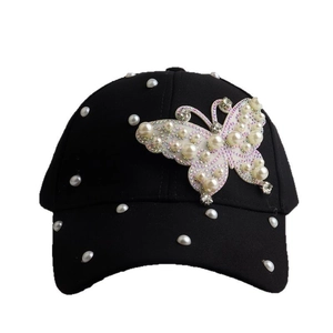 Black cotton baseball cap with white pearls and a sparkling rhinestone butterfly patch