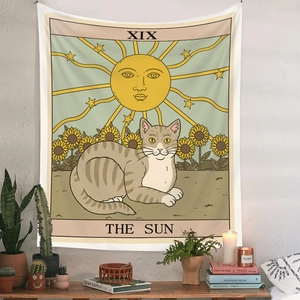 Detail of bohemian tarot tapestry with cat sun illustration and sunflower accents