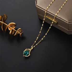 Elegant gold titanium steel necklace with green emerald waterdrop pendant and zircons