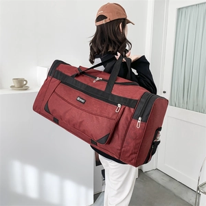 Rear view of a burgundy nylon travel bag showing its large capacity and sturdy hand straps