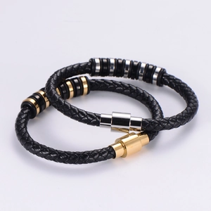 Braided leather bracelet with gold and silver stainless steel magnetic clasp