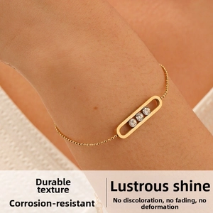 Detail of 18K gold plated bead chain bracelet with three sliding zircon stones