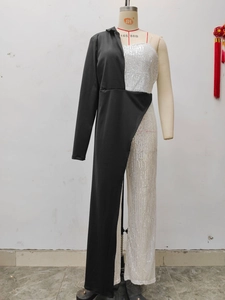 Detail of asymmetric silver sequins and black fabric contrast on a fashion jumpsuit