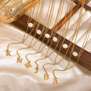 Golden Y-shaped necklace for women with white pearls and initial alphabet charms