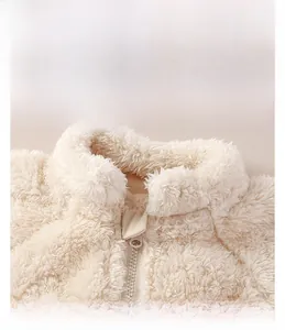 Detail of warm stand collar and zipper on ivory fleece infant winter jumpsuit