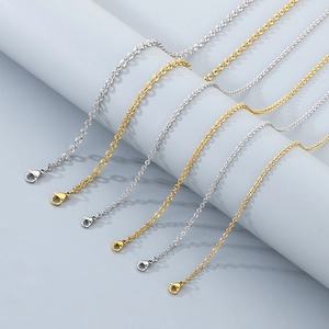 Detail of six textured stainless steel link necklaces in gold and silver with lobster clasps