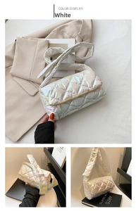 Detailed close-up of holographic white quilted puffer bag with chic diamond stitching