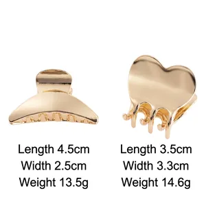 Golden crescent and heart metal hair claws with dimensions on white background