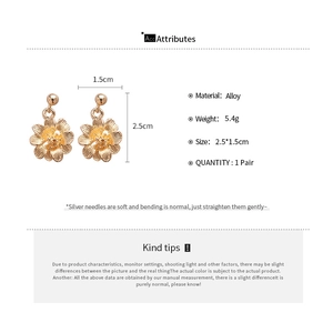 Detail view of flower and leaf tassel earrings with 2.5x1.5cm dimensions and silver needle