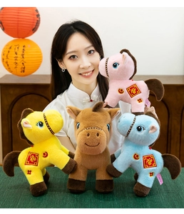 A model displays a variety of colorful plush horse dolls featuring Chinese 'Fu' embroidery.