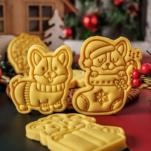 Christmas Corgi cookie cutter set featuring dogs in sweaters and holiday stockings