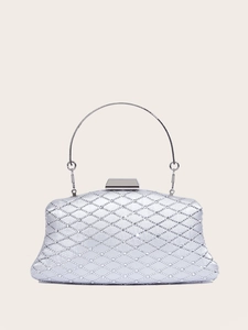 Detailed macro view of silver rhinestone diamond pattern on the luxury evening clutch bag