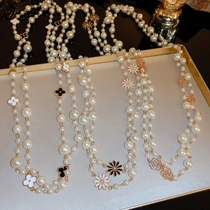 French style double-layer pearl necklace with floral motifs on a display tray
