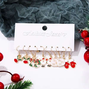 Set of 9 pairs of Christmas themed enamel earrings with Santa, reindeer and festive patterns