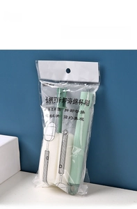 Detail of detachable sponge head on a long handle bottle brush with hanging packaging