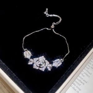 Macro detail of rose flower zircon bracelet with silver finish and adjustable slider clasp