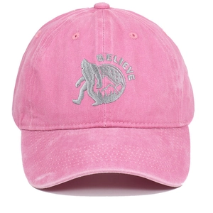 Close-up of BELIEVE Sasquatch embroidery on pink washed cotton vintage baseball cap