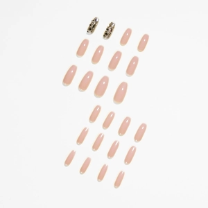 Faux ongles longs ovales rose poudré avec strass argentés et finition brillante