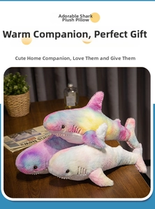 Detail of colorful gradient shark plush toy with soft texture and embroidered eyes