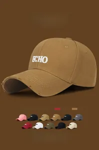 Detail of trendy distressed baseball cap with ECHO embroidery and frayed brim texture