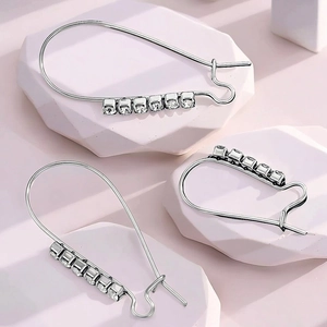 Silver stainless steel geometric hoop earrings with sparkling crystal accents for women