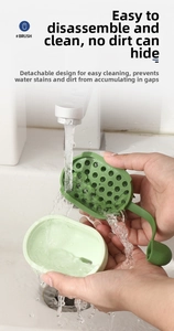 Macro shot of detachable silicone scalp brush being rinsed under water faucet for cleaning