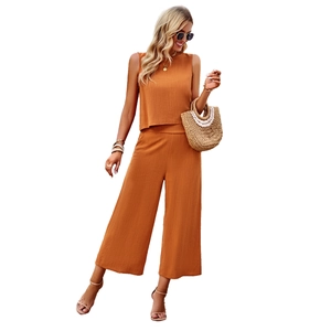 Women's two-piece set featuring brown sleeveless top and cotton-linen wide-leg trousers