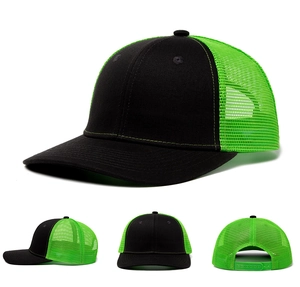 Detail view of the black and neon green trucker hat with breathable mesh and snapback closure