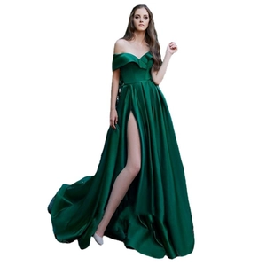 Elegant emerald green off-shoulder satin evening gown with a high slit and ruched waistline