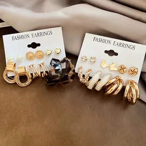 Golden earrings set featuring heart, butterfly designs and leopard print resin hoops