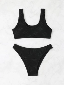 Solid black two-piece bikini set with unique crinkle textured fabric and backless design
