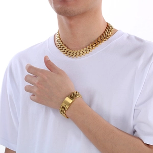 20mm gold Cuban link necklace and bracelet set for men and women on model