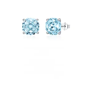 Macro view of S925 sterling silver ear studs with 925 hallmark and blue gemstone detail