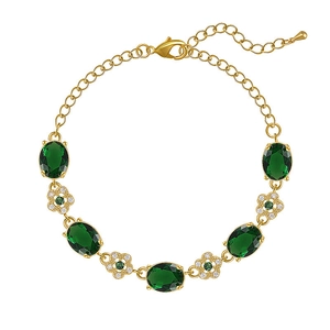 Bracelet plaqué or avec cristaux émeraude ovales et breloques de fleurs étincelantes