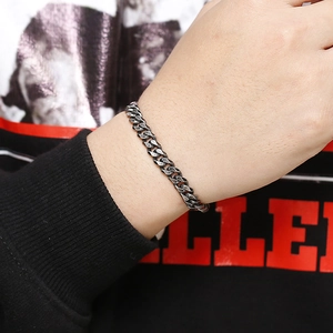 Close-up of vintage cuban link chain bracelet in silver finish on a male wrist