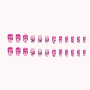 Pink marble gradient press-on nails with silver glitter accents in medium coffin shape