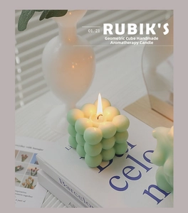 Macro detail of a light green bubble cube candle set against a minimalist aesthetic decor