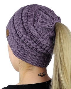 Detail view of purple chunky knit ponytail beanie with CC leather patch logo