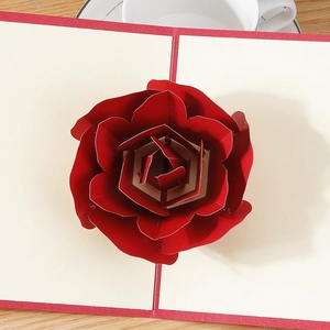 Romantic 3D pop-up red rose card for Valentine's Day or wedding proposal on wood background