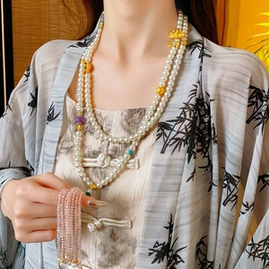 Double-layer pearl necklace with golden flower pendant and colorful beads in Neo-Chinese style