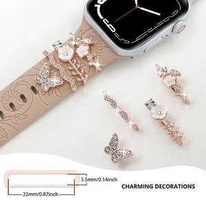 Detail view of 5-piece rose gold band charms for silicone smartwatch straps